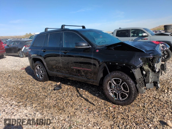 2022 Jeep Grand Cherokee Trailhawk with VIN 1C4RJHCG1N8574207, listed as a Copart auction lot 52789925 with 31,549 mi miles and Salvage title. Bid and sale history available at DreamBid. Image 4.
