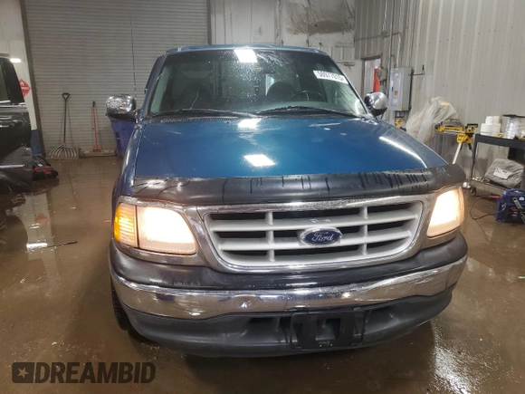 1999 Ford F-150 z VIN 1FTRF17W6XNB72620, wystawiony jako Copart lot #50977015 z przebiegiem Nie podano mil oraz Szkoda całkowita • Salvage title. Historia ofert i sprzedaży dostępna na DreamBid. Obrazek 5.