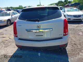 2013 Cadillac SRX Premium Collection with VIN 3GYFNEE33DS554556, listed as a IAAI auction lot 42152972 with 144,668 mi miles and . Bid and sale history available at DreamBid. Image 16.
