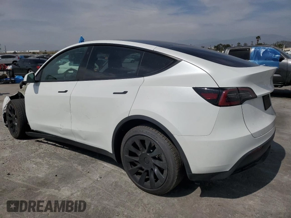 2023 Tesla Model Y Long Range z VIN 7SAYGDEE8PA030286, wystawiony jako Copart lot #50945465 z przebiegiem 43 676 mil mil oraz Szkoda całkowita • Salvage title. Historia ofert i sprzedaży dostępna na DreamBid. Obrazek 2.