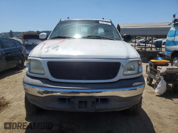 1999 Ford F-150 with VIN 1FTZX1727XKA70271, listed as a Copart auction lot 58016095 with 219,093 mi miles and Salvage title. Bid and sale history available at DreamBid. Image 5.