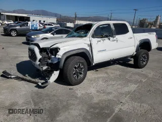 2020 Toyota Tacoma SR5 with VIN 3TMAZ5CN8LM115056, listed as a Copart auction lot 46948805 with 87,713 mi miles and Salvage title. Bid and sale history available at DreamBid. Image 1.