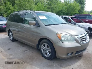 2010 Honda Odyssey Touring with VIN 5FNRL3H99AB047551, listed as a IAAI auction lot 42659567 with 160,969 mi miles and . Bid and sale history available at DreamBid. Image 1.