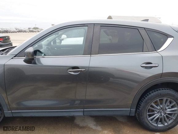 2021 Mazda CX-5 Touring with VIN JM3KFBCM0M0342210, listed as a IAAI auction lot 41236013 with 96,012 mi miles. Bid and sale history available at carsss.com. Image 15.