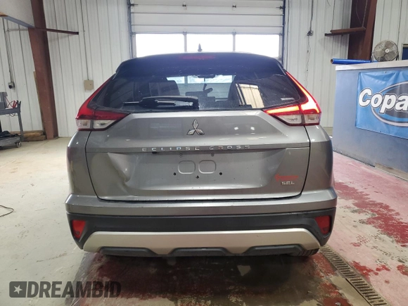 2022 Mitsubishi Eclipse Cross SE z VIN JA4ATWAA5NZ000384, wystawiony jako Copart lot #53619155 z przebiegiem 21 931 mil mil oraz Szkoda całkowita • Salvage title. Historia ofert i sprzedaży dostępna na DreamBid. Obrazek 6.