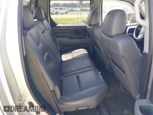 2007 Honda Ridgeline RTL z VIN 2HJYK16527H521549, wystawiony jako IAAI lot #42192558 z przebiegiem 227 162 mil mil oraz . Historia ofert i sprzedaży dostępna na DreamBid. Obrazek 8.