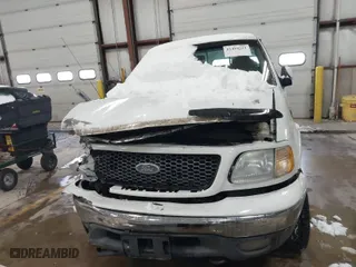 2001 Ford F-150 SuperCrew XLT with VIN 1FTRW08L41KF19093, listed as a IAAI auction lot 41419212 with 157,696 mi miles. Bid and sale history available at carsss.com. Image 12.