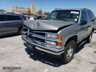 1999 Chevrolet Tahoe with VIN 3GNEK18RXXG190783, listed as a Copart auction lot 52666545 with 240,094 mi miles and Salvage Title. Bid and sale history available at carsss.com. Image 12.