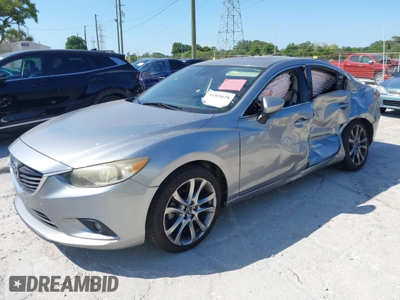 2014 Mazda 6 i Grand Touring с VIN JM1GJ1W6XE1159641, выставлен на аукционе IAAI как лот 39305628 с пробегом 107 853 миль миль и . История ставок и продаж доступна на DreamBid. Изображение 2.