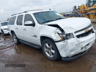 2014 Chevrolet Suburban LT with VIN 1GNSCJE04ER107836, listed as a IAAI auction lot 41698679 with 106,139 mi miles. Bid and sale history available at carsss.com. Image 1.