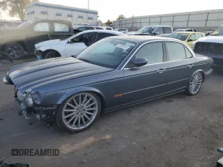 2004 Jaguar XJ with VIN SAJWA73B64TG30921, listed as a Copart auction lot 71267074 with 20,031 mi miles and Salvage Title. Bid and sale history available at carsss.com. Image 1.