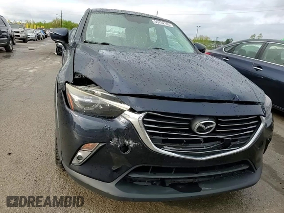 2017 Mazda CX-3 Grand Touring z VIN JM1DKFD75H0141048, wystawiony jako Copart lot #55752185 z przebiegiem 89 960 mil mil oraz Szkody całkowita. Historia ofert i sprzedaży dostępna na DreamBid. Obrazek 14.