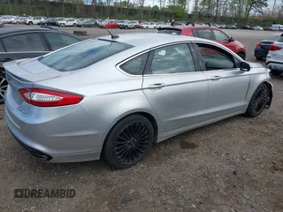 2014 Ford Fusion Titanium with VIN 3FA6P0K95ER151625, listed as a IAAI auction lot 42109141 with 182,328 mi miles and . Bid and sale history available at DreamBid. Image 4.