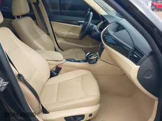 2014 BMW X1 sDrive28i with VIN WBAVM1C54EVW46561, listed as a IAAI auction lot 41880387 with 125,096 mi miles. Bid and sale history available at carsss.com. Image 5.