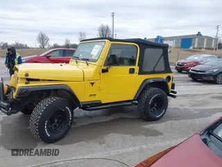 2000 Jeep Wrangler SE with VIN 1J4FA29P2YP797156, listed as a IAAI auction lot 41517183 with 114,236 mi miles. Bid and sale history available at carsss.com. Image 14.
