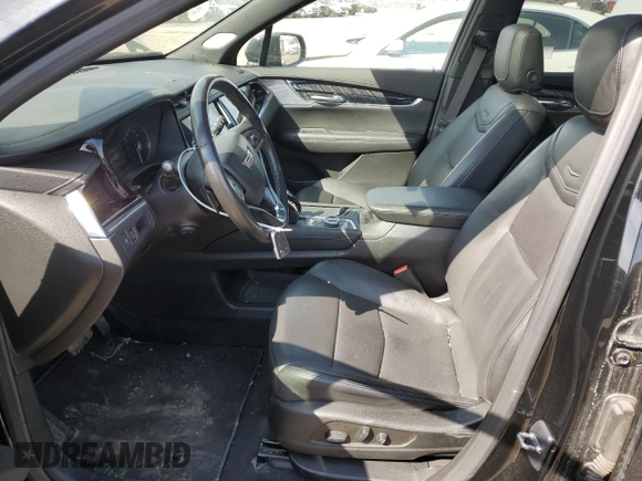 2023 Cadillac XT6 FWD Premium Luxury with VIN 1GYKPCRS4PZ103061, listed as a Copart auction lot 49300205 with 72,131 mi miles and Salvage title. Bid and sale history available at DreamBid. Image 7.