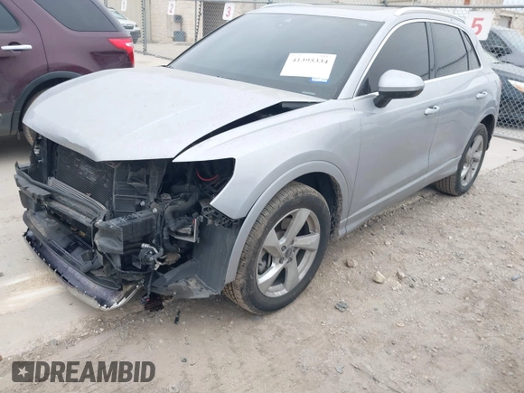 2021 Audi Q3 Premium with VIN WA1AUCF35M1066713, listed as a IAAI auction lot 41395334 with 82,724 mi miles and . Bid and sale history available at DreamBid. Image 2.