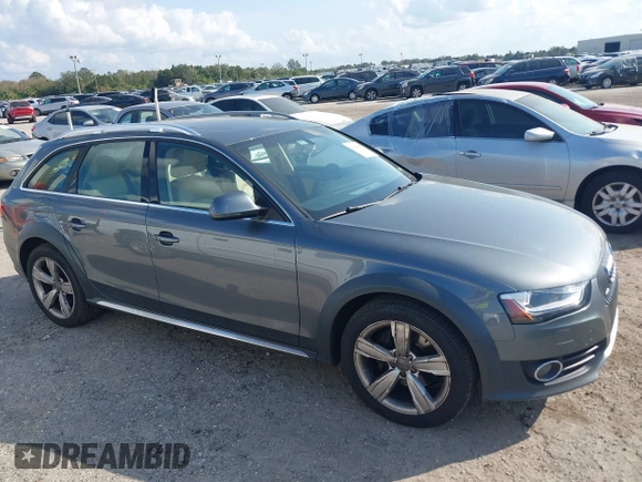 2014 Audi allroad A4 Premium Plus z VIN WA1UFAFL7EA006011, wystawiony jako IAAI lot #41494881 z przebiegiem 70 461 mil mil oraz . Historia ofert i sprzedaży dostępna na DreamBid. Obrazek 13.