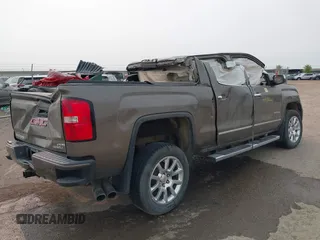 2015 GMC Sierra 1500 Denali z VIN 3GTU2WEJ6FG174160, wystawiony jako IAAI lot #40118246 z przebiegiem Nie podano mil oraz . Historia ofert i sprzedaży dostępna na DreamBid. Obrazek 4.