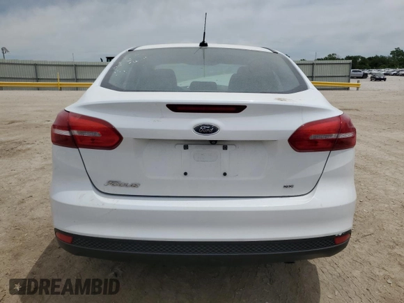 2018 Ford Focus SE with VIN 1FADP3F27JL264670, listed as a Copart auction lot 57184815 with 35,187 mi miles and Salvage title. Bid and sale history available at DreamBid. Image 6.