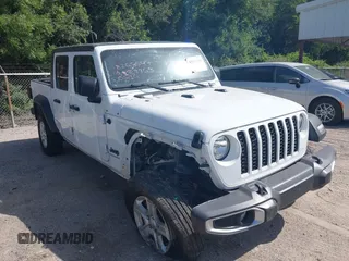 2023 Jeep Gladiator Sport S with VIN 1C6HJTAGXPL539965, listed as a IAAI auction lot 42552742 with 57,918 mi miles and . Bid and sale history available at DreamBid. Image 1.