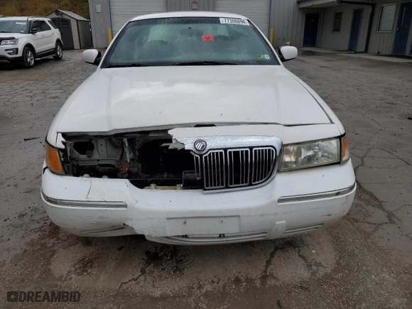 1998 Mercury Grand Marquis GS with VIN 2MEFM74WXWX619140, listed as a Copart auction lot 77300894 with 124,064 mi miles and Salvage Title. Bid and sale history available at carsss.com. Image 5.