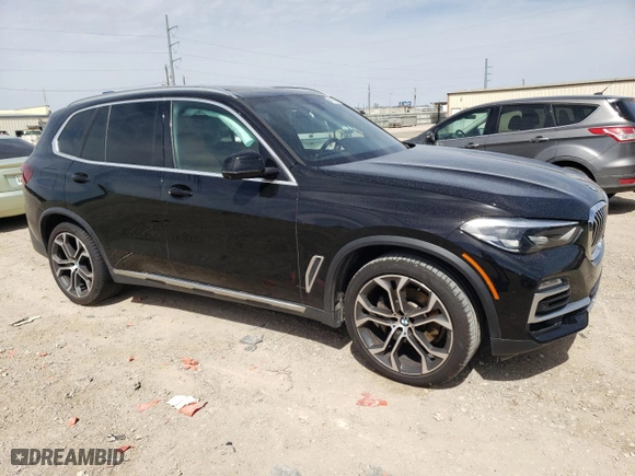 2021 BMW X5 sDrive40i with VIN 5UXCR4C05M9G60740, listed as a Copart auction lot 47989915 with 0 mi miles and Salvage Title. Bid and sale history available at carsss.com. Image 4.