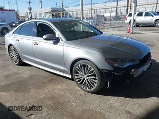2016 Audi A6 2.0T Premium Plus with VIN WAUGFAFC8GN132633, listed as a IAAI auction lot 41610370 with 95,701 mi miles. Bid and sale history available at carsss.com. Image 1.