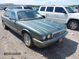 1996 Jaguar XJ with VIN SAJKX6743TC763201, listed as a IAAI auction lot 42601445 with 121,052 mi miles and . Bid and sale history available at DreamBid. Image 1.