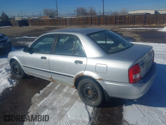 2002 Mazda Protege DX with VIN JM1BJ225321588015, listed as a IAAI auction lot 41409015 with 170,815 mi miles and . Bid and sale history available at DreamBid. Image 3.