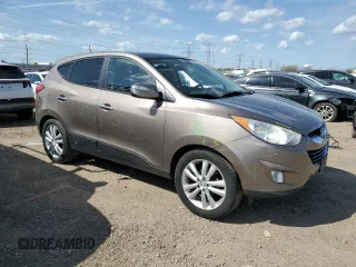 2010 Hyundai Tucson GLS with VIN KM8JU3AC8AU056499, listed as a Copart auction lot 53057365 with 119,906 mi miles and Salvage Title. Bid and sale history available at DreamBid. Image 4.