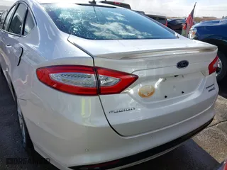 2015 Ford Fusion Titanium Hybrid with VIN 3FA6P0RU9FR308973, listed as a IAAI auction lot 41754320 with 82,686 mi miles. Bid and sale history available at carsss.com. Image 16.