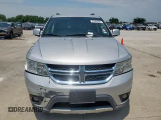 2012 Dodge Journey SXT with VIN 3C4PDCBG1CT134375, listed as a Copart auction lot 61059305 with 165,913 mi miles and Salvage title. Bid and sale history available at DreamBid. Image 5.