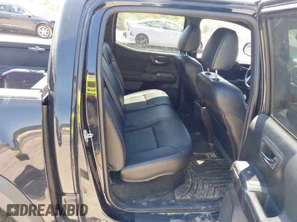 2019 Toyota Tacoma SR with VIN 5TFCZ5AN4KX208354, listed as a IAAI auction lot 42771410 with 77,509 mi miles and . Bid and sale history available at DreamBid. Image 8.