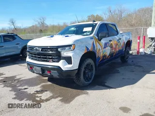 2023 Chevrolet Silverado 1500 LT Trail Boss with VIN 3GCUDFED3PG197885, listed as a IAAI auction lot 41733427 with 64,911 mi miles and . Bid and sale history available at DreamBid. Image 2.