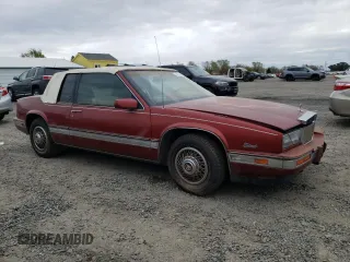 1986 Cadillac Eldorado z VIN 1G6EL5784GU616263, wystawiony jako Copart lot #48741325 z przebiegiem 59 213 mil mil oraz Tytuł czysty. Historia ofert i sprzedaży dostępna na DreamBid. Obrazek 4.