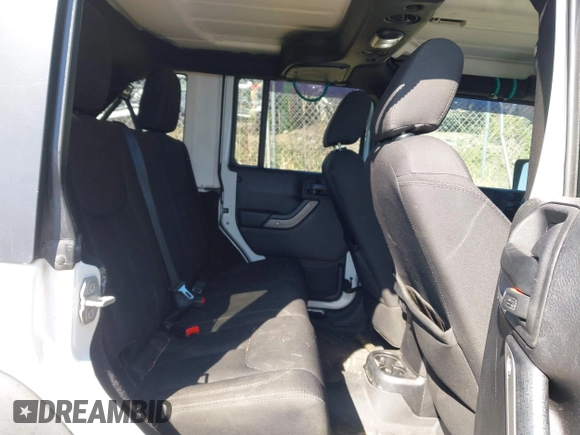 2015 Jeep Wrangler Unlimited Willys Wheeler with VIN 1C4BJWDG0FL546000, listed as a IAAI auction lot 41984566 with 112,742 mi miles and . Bid and sale history available at DreamBid. Image 8.