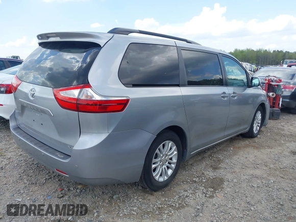 2015 Toyota Sienna XLE with VIN 5TDYK3DC7FS659864, listed as a IAAI auction lot 41958112 with 121,257 mi miles and . Bid and sale history available at DreamBid. Image 4.