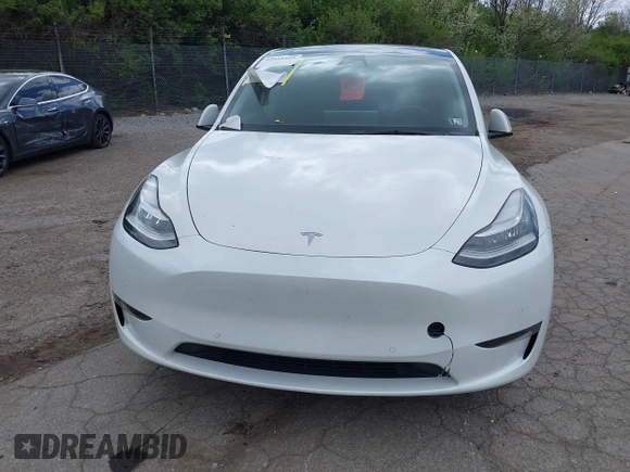 2022 Tesla Model Y Long Range z VIN 7SAYGDEE7NF385207, wystawiony jako IAAI lot #42054449 z przebiegiem 52 834 mil mil oraz . Historia ofert i sprzedaży dostępna na DreamBid. Obrazek 12.