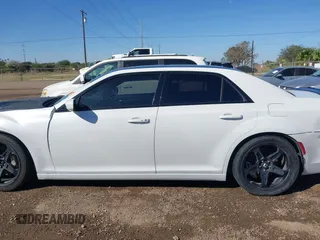 2012 Chrysler 300 SRT-8 with VIN 2C3CCAFJ9CH801749, listed as a IAAI auction lot 40912606 with 144,404 mi miles and . Bid and sale history available at DreamBid. Image 15.