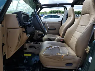1999 Jeep Wrangler Sport with VIN 1J4FY19S0XP402688, listed as a Copart auction lot 58968125 with 211,910 mi miles and Salvage title. Bid and sale history available at DreamBid. Image 7.