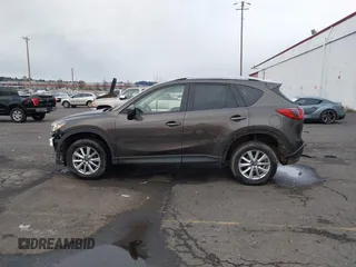2016 Mazda CX-5 Touring with VIN JM3KE4CY5G0695242, listed as a IAAI auction lot 41795135 with 195,162 mi miles. Bid and sale history available at carsss.com. Image 13.