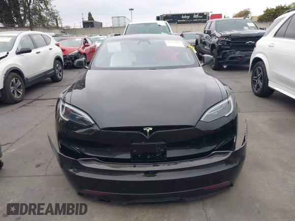 2022 Tesla Model S with VIN 5YJSA1E55NF474342, listed as a IAAI auction lot 41870994 with 33,804 mi miles and . Bid and sale history available at DreamBid. Image 13.