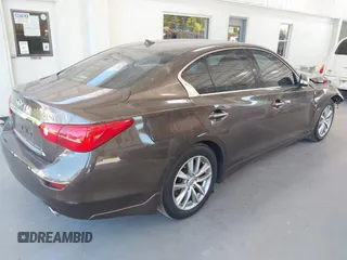2015 Infiniti Q50 Premium with VIN JN1BV7AP4FM330386, listed as a IAAI auction lot 42028771 with 75,533 mi miles. Bid and sale history available at carsss.com. Image 4.
