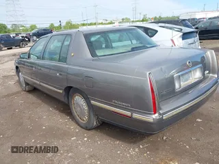 1999 Cadillac DeVille DHS z VIN 1G6KE54Y2XU752599, wystawiony jako IAAI lot #42141950 z przebiegiem 135 999 mil mil oraz . Historia ofert i sprzedaży dostępna na DreamBid. Obrazek 3.