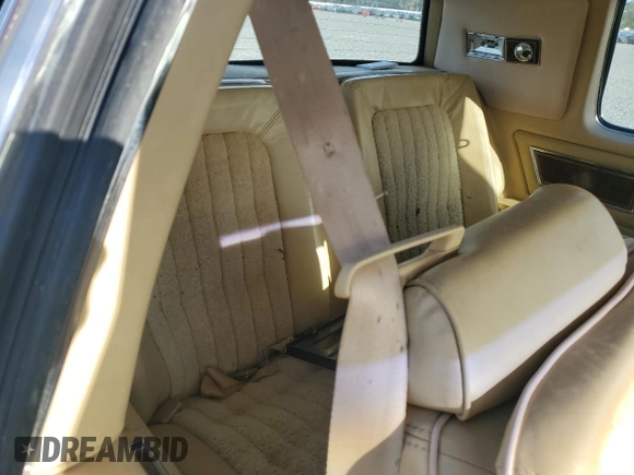 1985 Oldsmobile Toronado Custom Brougham z VIN 1G3EZ57Y6FE321802, wystawiony jako Copart lot #77305454 z przebiegiem 51 559 mil mil oraz Szkoda całkowita • Salvage title. Historia ofert i sprzedaży dostępna na DreamBid. Obrazek 10.