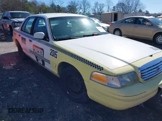 1999 Ford Crown Victoria Police with VIN 2FAFP71WXXX239705, listed as a IAAI auction lot 41601390 with 161,454 mi miles. Bid and sale history available at carsss.com. Image 1.