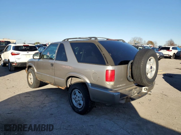 1999 Chevrolet Blazer LS с VIN 1GNCT18W1XK140616, выставлен на аукционе Copart как лот 78567434 с пробегом 244 356 миль миль и Чистый • Clean title. История ставок и продаж доступна на DreamBid. Изображение 2.
