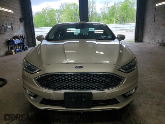 2017 Ford Fusion Titanium z VIN 3FA6P0K96HR132389, wystawiony jako Copart lot #57312665 z przebiegiem Nie podano mil oraz Szkoda całkowita • Salvage title. Historia ofert i sprzedaży dostępna na DreamBid. Obrazek 5.