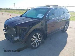 2017 Honda Pilot Touring with VIN 5FNYF5H96HB038413, listed as a IAAI auction lot 42594065 with 130,501 mi miles and . Bid and sale history available at DreamBid. Image 17.